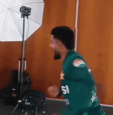 a man in a green jersey with the number 51 on the back