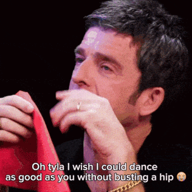 a man is crying while holding a red napkin with the words oh tyla i wish i could dance as good as you