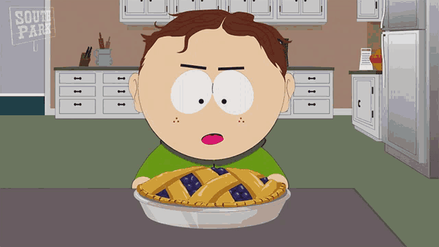a cartoon character from south park is holding a pie