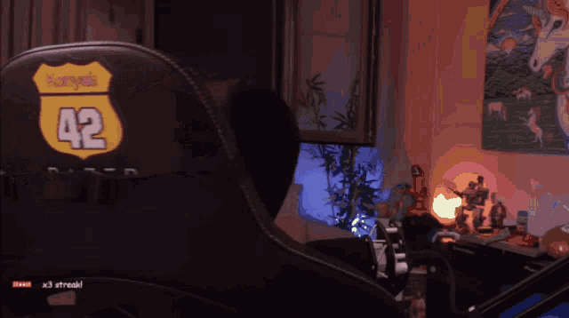 a black chair has a sticker on it that says kansas 42