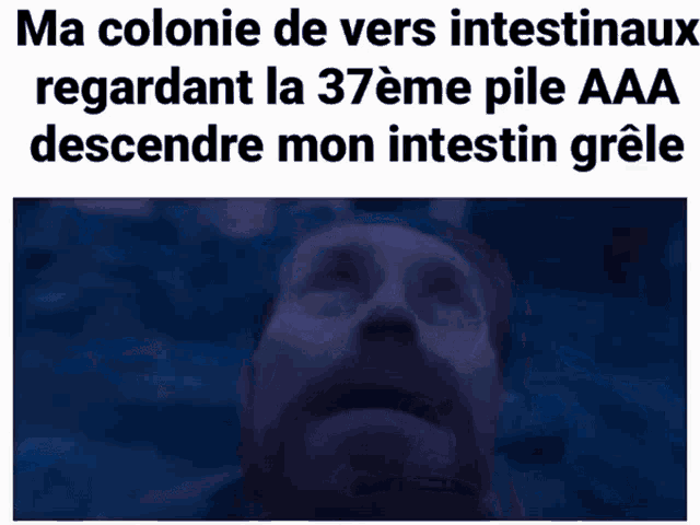 a man with a beard is looking up at the sky with the caption ma colonie de vers intestinaux regardant la 37eme pile