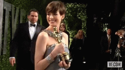 Anne Hathaway Winner GIF - Anne Hathaway Winner Grammy Award GIFs