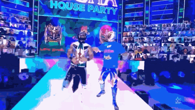 two wrestlers are walking down a runway in front of a sign that says " house party "
