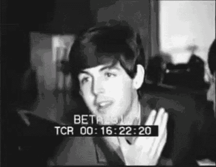 a black and white photo of a young man with a time stamp of tcr 00 16 22 20 .