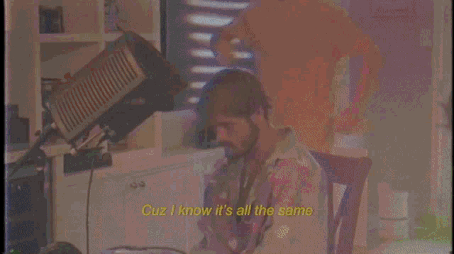 a person singing into a microphone with the words space jams on feet written below them