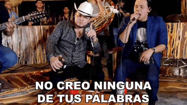 a man singing into a microphone with the words no creo ninguna de tus palabras behind him