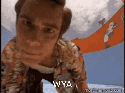 a close up of a man 's face with the words wya on the bottom .