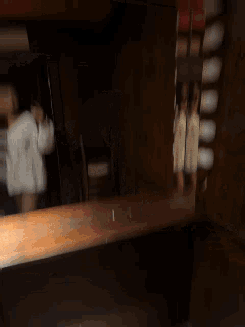 a man and a woman are taking a selfie in a mirror