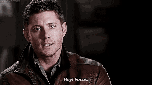 a man in a brown leather jacket is talking and saying `` hey focus '' .