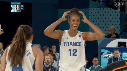 a female basketball player wearing the number 12 jersey