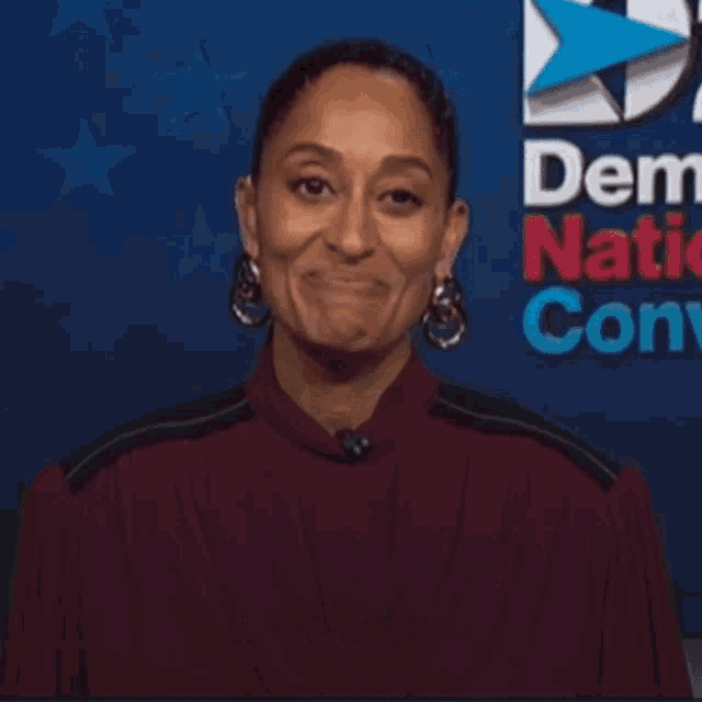 a woman says hello kamala in front of a blue background