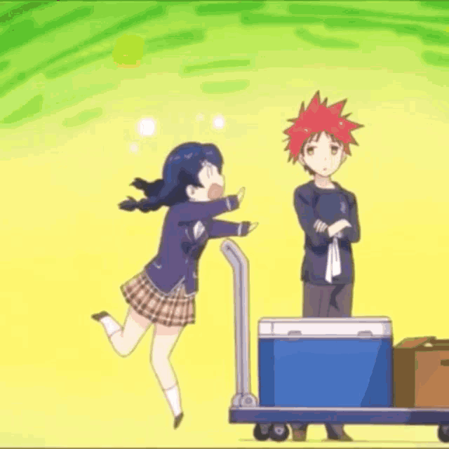 a girl is jumping in the air while a man pushes a cart with a blue cooler on it