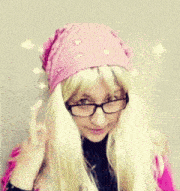 a woman with blonde hair wearing glasses and a pink bandana