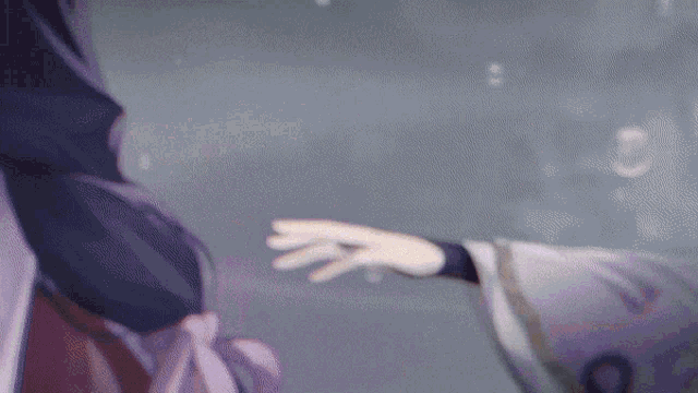 a close up of a person reaching out to another person