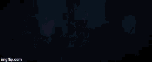 a person is standing in a dark room with a light coming out of their head .