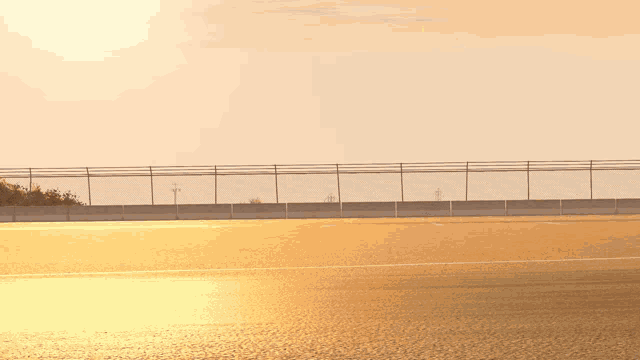 a fcv race car is driving down a track