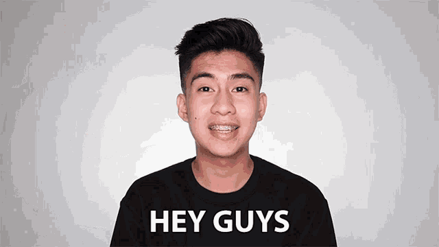 a young man with braces on his teeth is smiling and saying hey guys