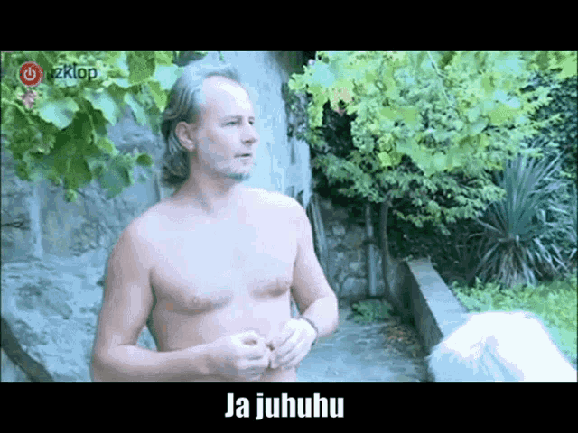 a shirtless man is standing in front of a sign that says ja juhuhu