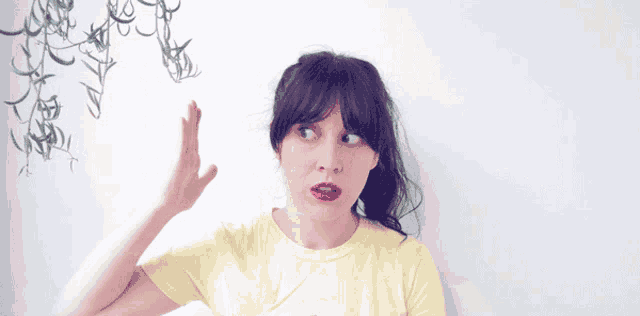 a woman in a yellow shirt with a panda on it