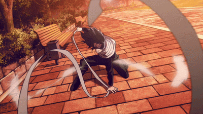 a man is kneeling down on a brick sidewalk and holding a ribbon