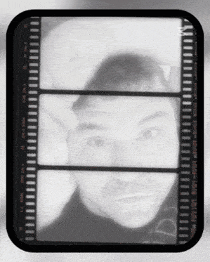 a black and white photo of a man with the word kodak on the bottom right corner