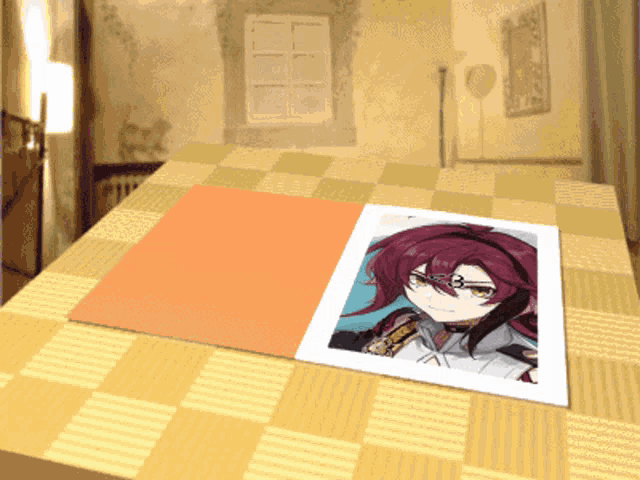 a picture of a girl with red hair is laying on a table