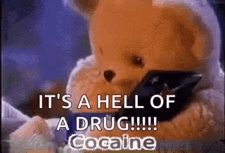 a teddy bear is holding a cell phone and says `` it 's a hell of a drug !!! ''