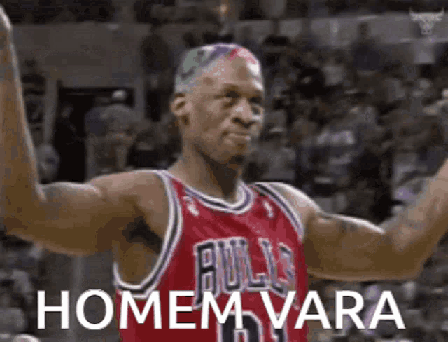 a basketball player with a rainbow haircut is wearing a red bulls jersey .