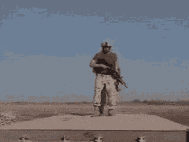a group of soldiers are holding guns in a field