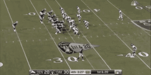 a football game is being played between the raiders and denver broncos