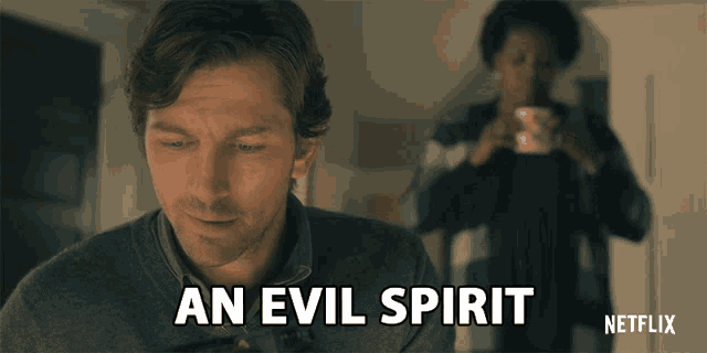 a man says an evil spirit in front of a woman drinking from a cup