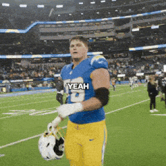 a football player wearing a blue jersey with the number 13 on it