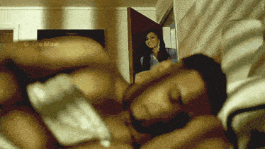 a blurred image of a man laying on a bed with the caption " the maw "