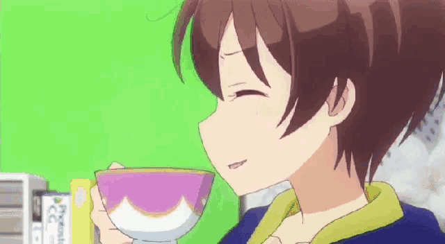 a girl is drinking a cup of tea from a purple bowl .