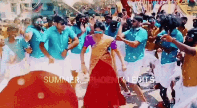 a woman in a red dress is dancing in front of a crowd of people with the words summer phoenix edits on the bottom