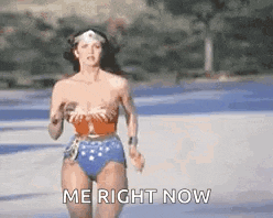 a woman in a bikini is running down a road and says `` me right now '' .