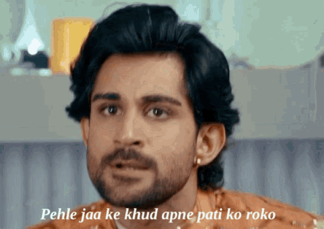 a man with a beard has the words pehle jaa ke khud apne pati ko roko written below him