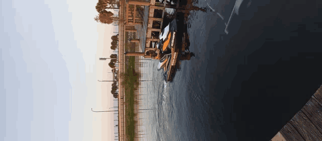 a sea doo jet ski is floating in the water near a dock