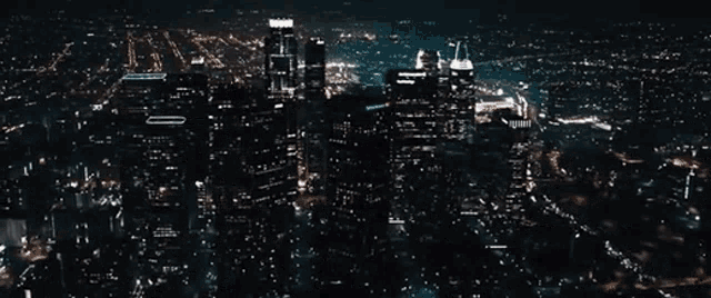 an aerial view of a city at night and the name ryan gorling