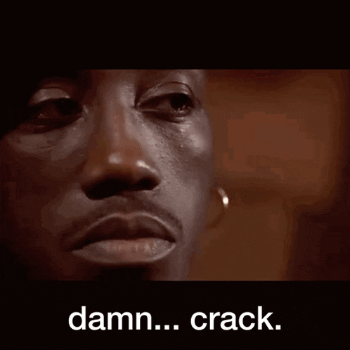 a close up of a man 's face with the words damn crack on the bottom
