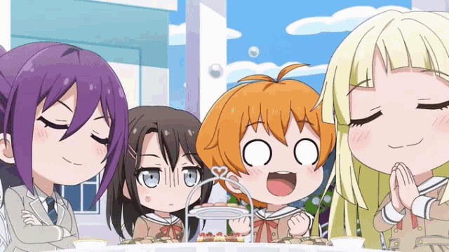 a group of anime girls standing around a table