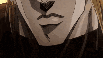 a close up of a man 's face with a mustache and a tongue sticking out .