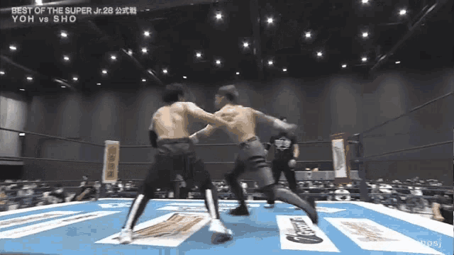 two men are fighting in a boxing ring with the words best of the super jr. 28 yoh vs sho