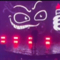 a sign that says ' evil ' on it is lit up in the dark