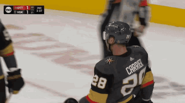 a hockey player wearing a number 28 jersey