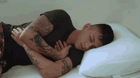 a man has a tattoo on his arm that says " another word "