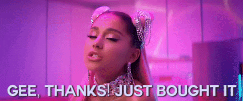 ariana grande is wearing a headband with rhinestones on it and a choker .