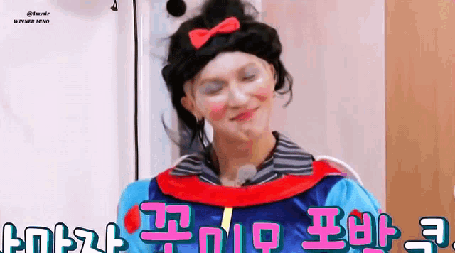 a man is wearing a snow white costume and making a face .