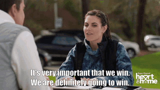 a woman talking to a man with the words it 's very important that we win