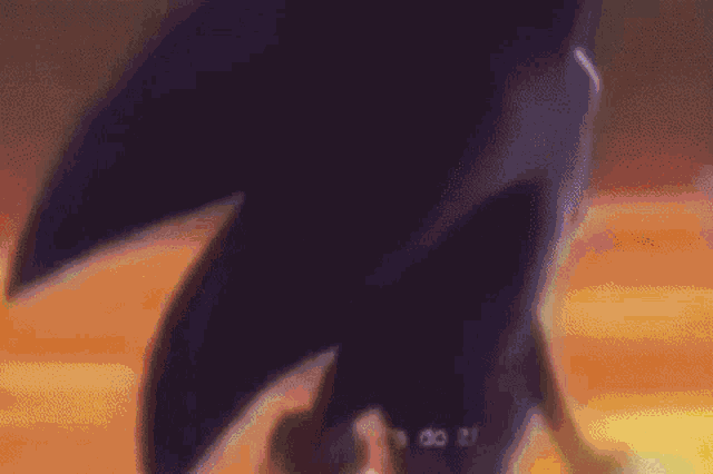 a close up of a cartoon character , sonic the hedgehog , standing in front of a fireball .